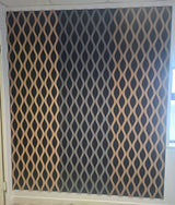 A large wall panel featuring a repeating diamond lattice pattern in beige and dark charcoal gray, installed on a wall in an interior room